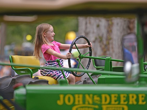 W kid on tractor.jpg